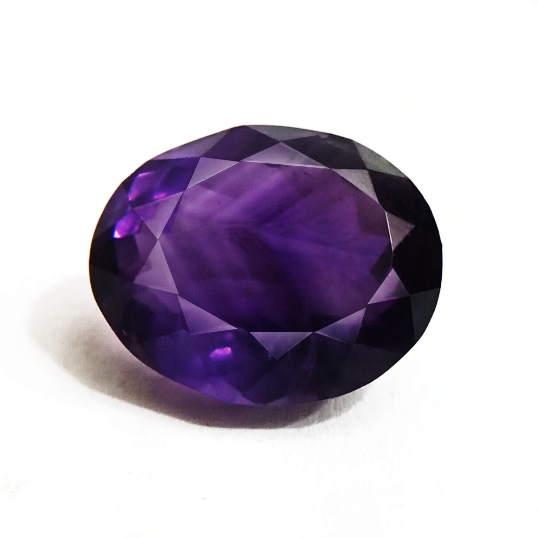 A beautiful Natural Amethyst gemstone with a deep purple hue, symbolizing peace, clarity, and spiritual growth.