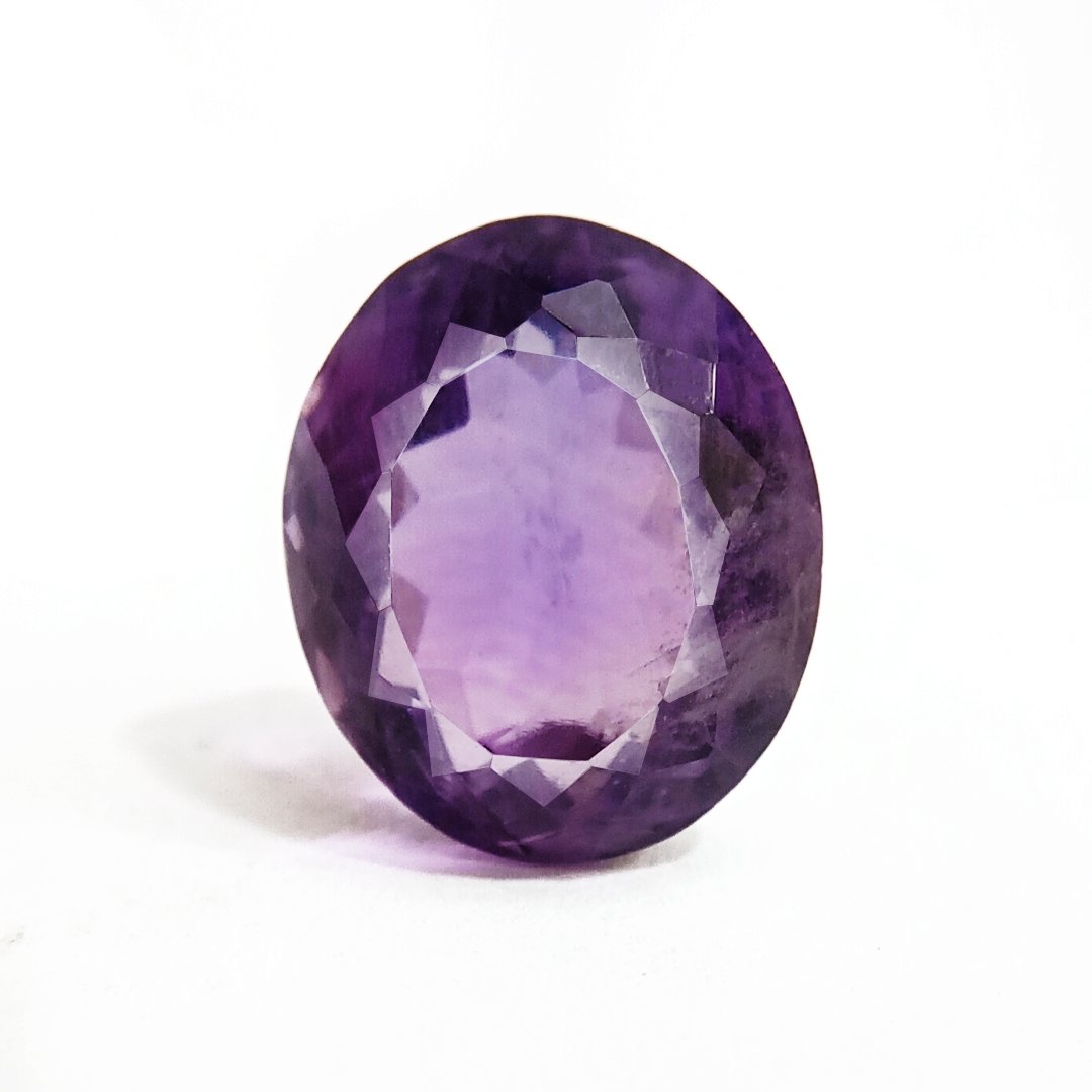 A beautiful Natural Amethyst gemstone with a deep purple hue, symbolizing peace, clarity, and spiritual growth.