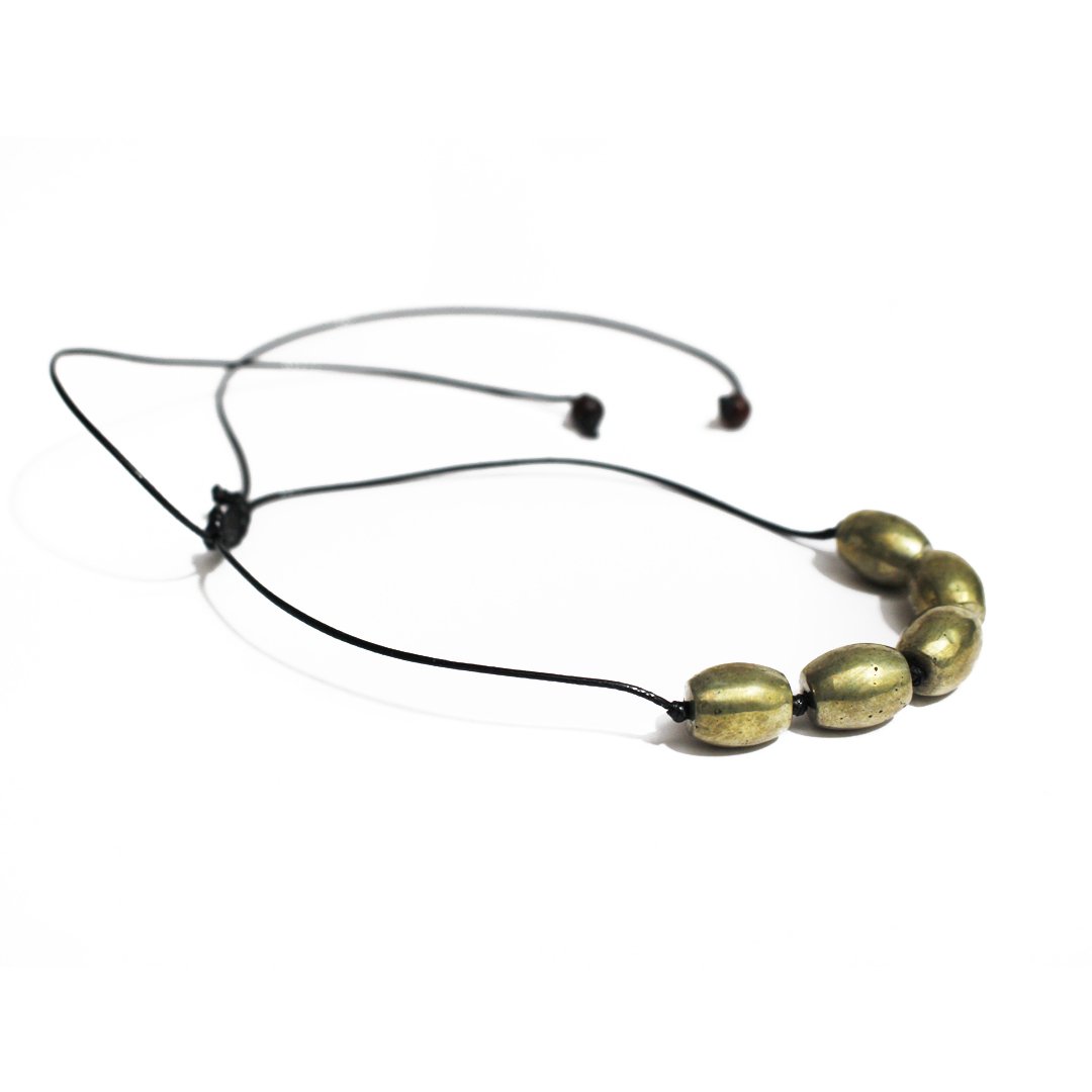 A Parad Pendant – Drum Shape, featuring a smooth metallic finish and spiritual significance.