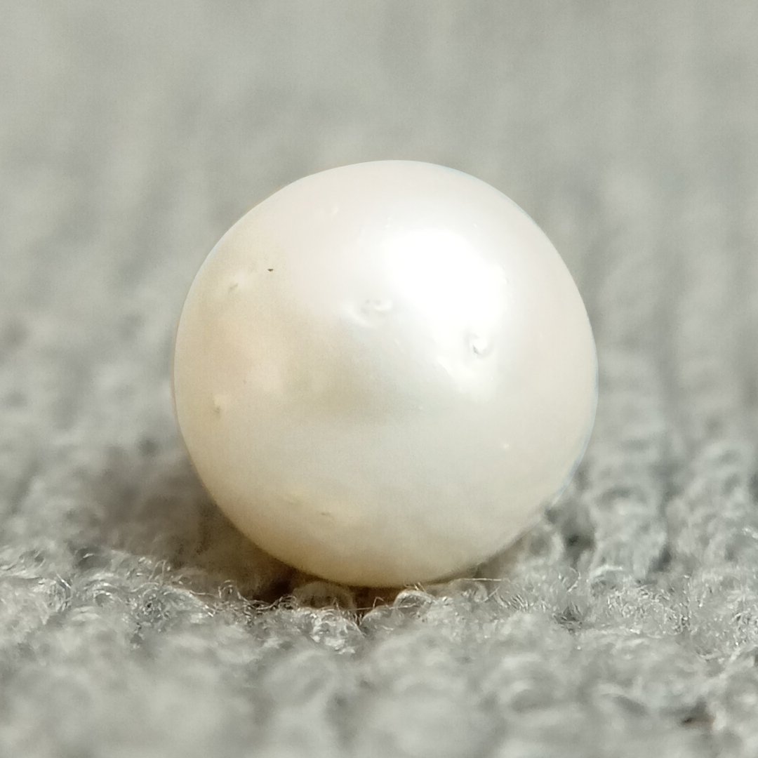A genuine South Sea Pearl gemstone, revered for wisdom, emotional balance, and prosperity.