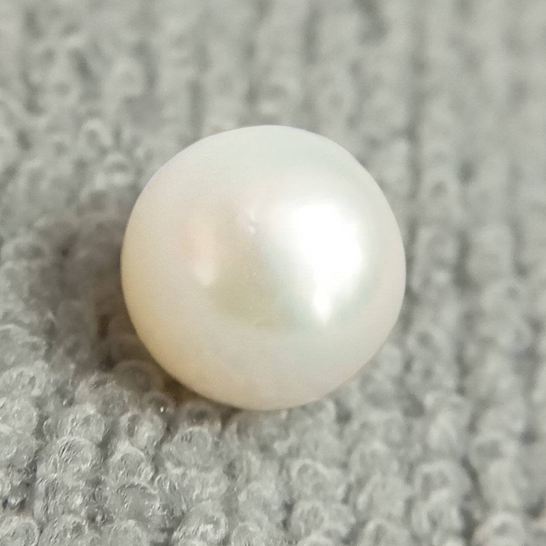 A genuine South Sea Pearl gemstone, revered for wisdom, emotional balance, and prosperity.