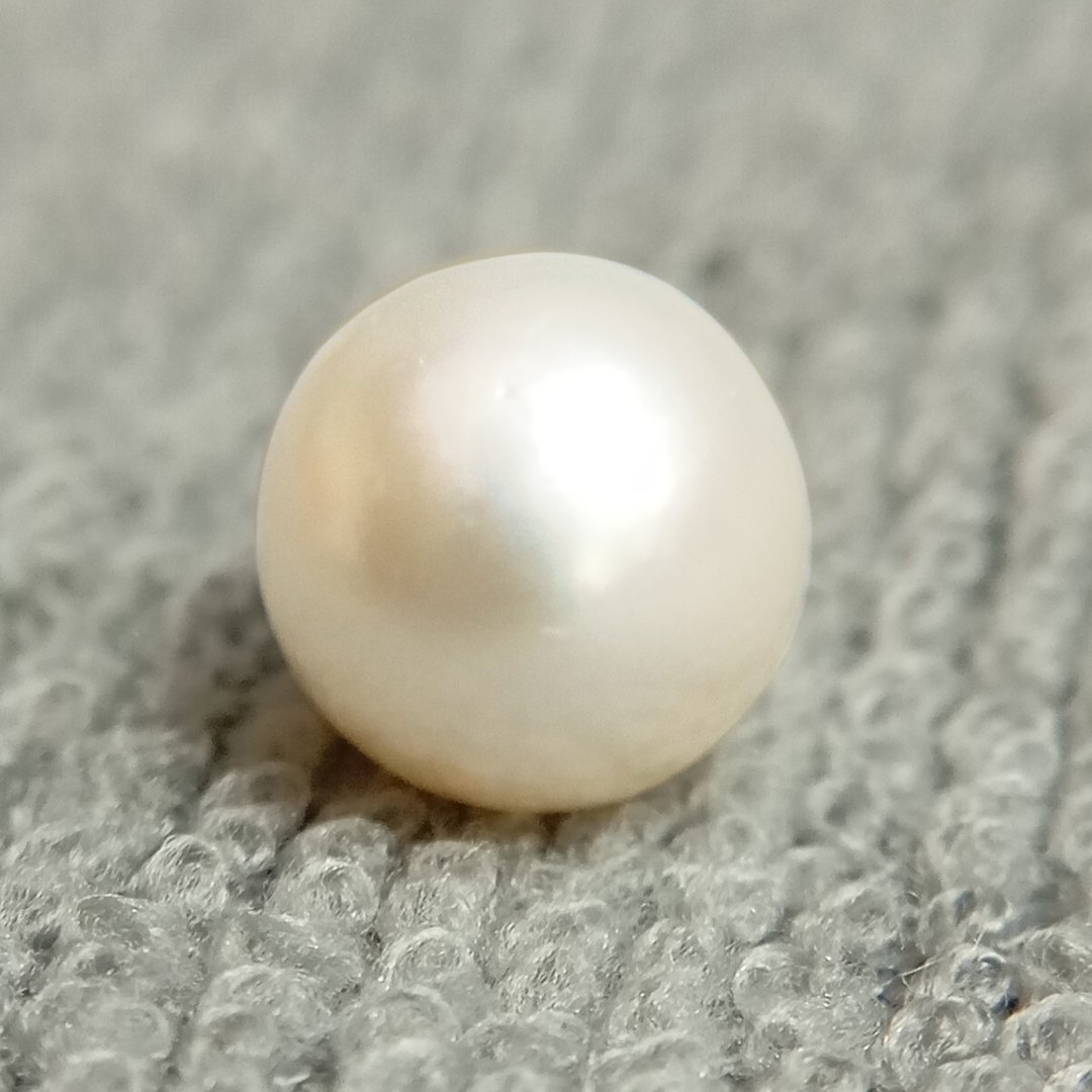 A genuine South Sea Pearl gemstone, revered for wisdom, emotional balance, and prosperity.