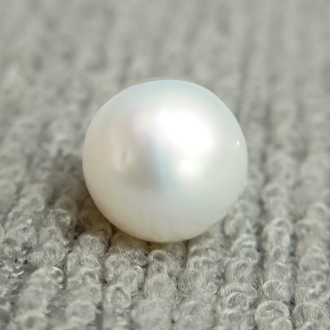 A genuine South Sea Pearl gemstone, revered for wisdom, emotional balance, and prosperity.