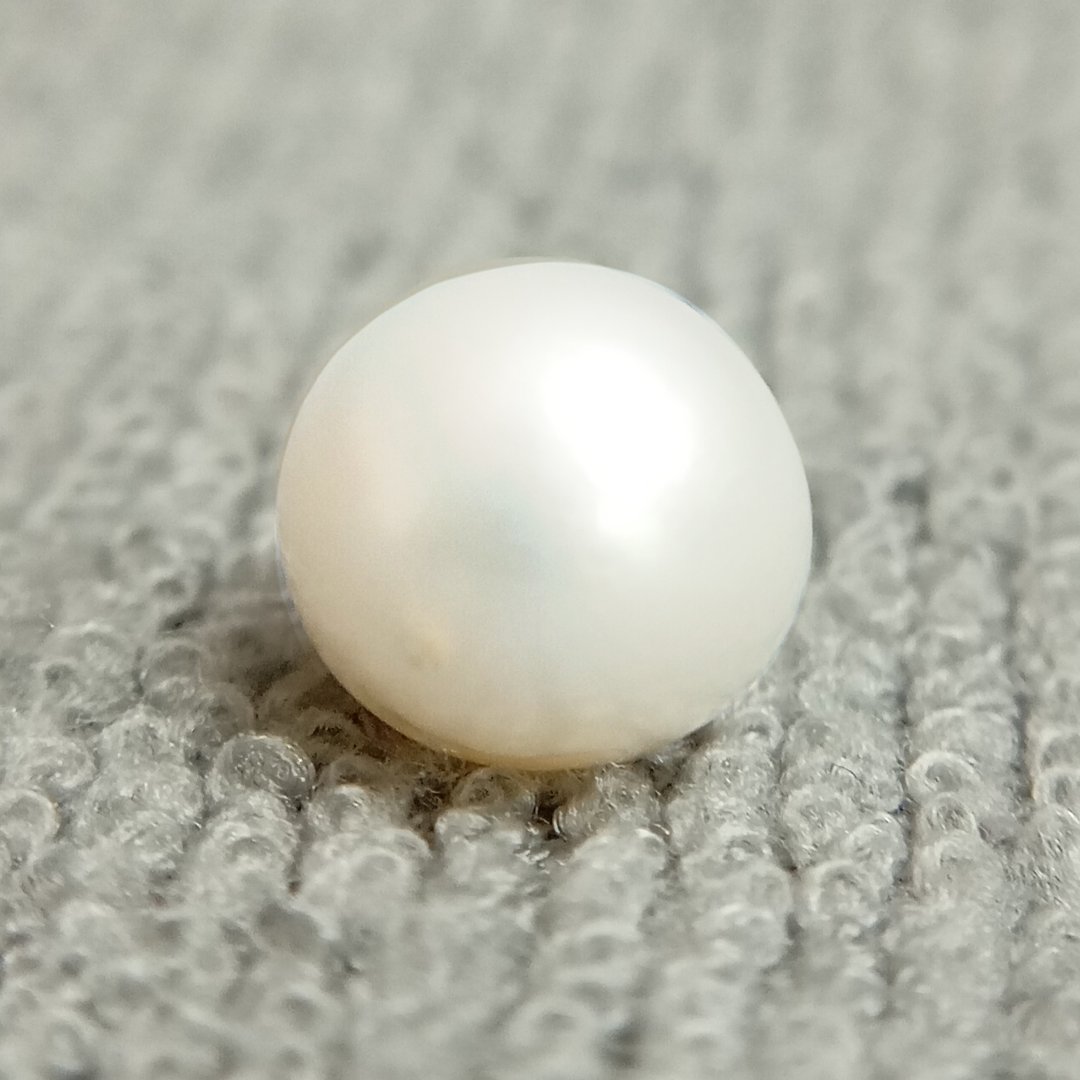 A genuine South Sea Pearl gemstone, revered for wisdom, emotional balance, and prosperity.