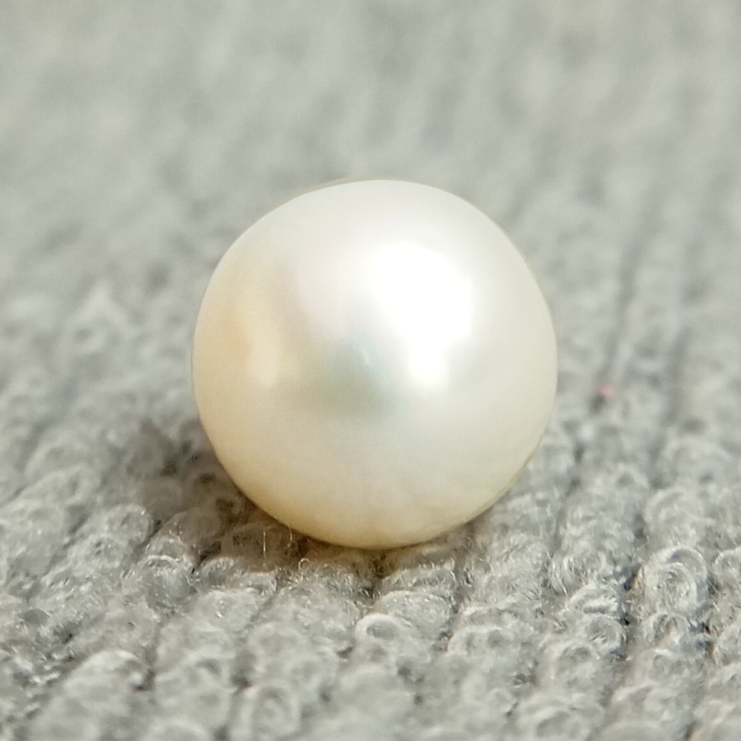 A genuine South Sea Pearl gemstone, revered for wisdom, emotional balance, and prosperity.