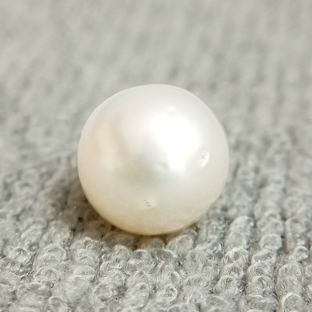 A genuine South Sea Pearl gemstone, revered for wisdom, emotional balance, and prosperity.