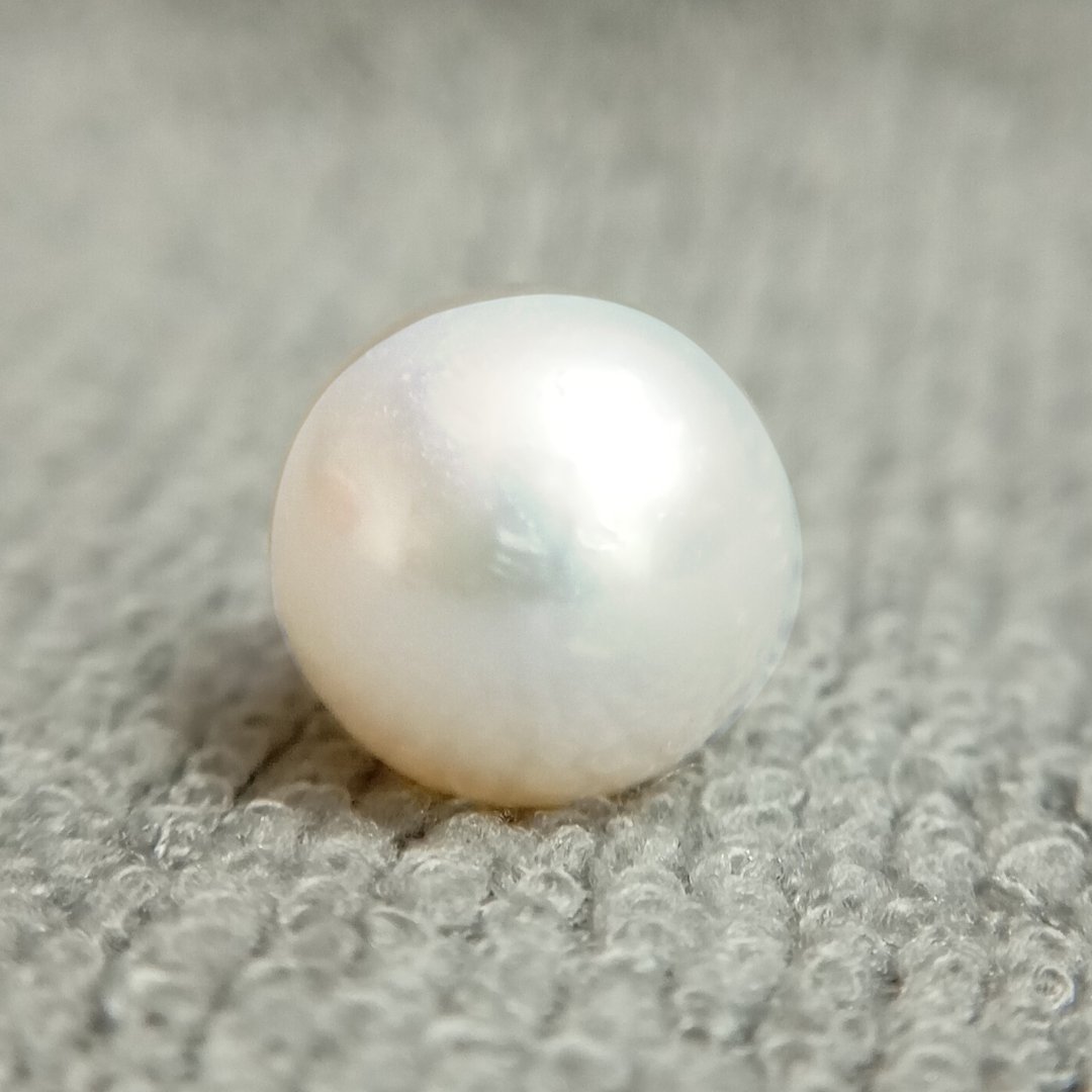 A genuine South Sea Pearl gemstone, revered for wisdom, emotional balance, and prosperity.