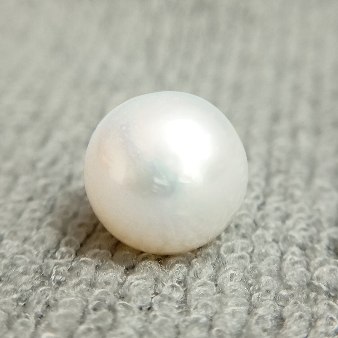 A genuine South Sea Pearl gemstone, revered for wisdom, emotional balance, and prosperity.