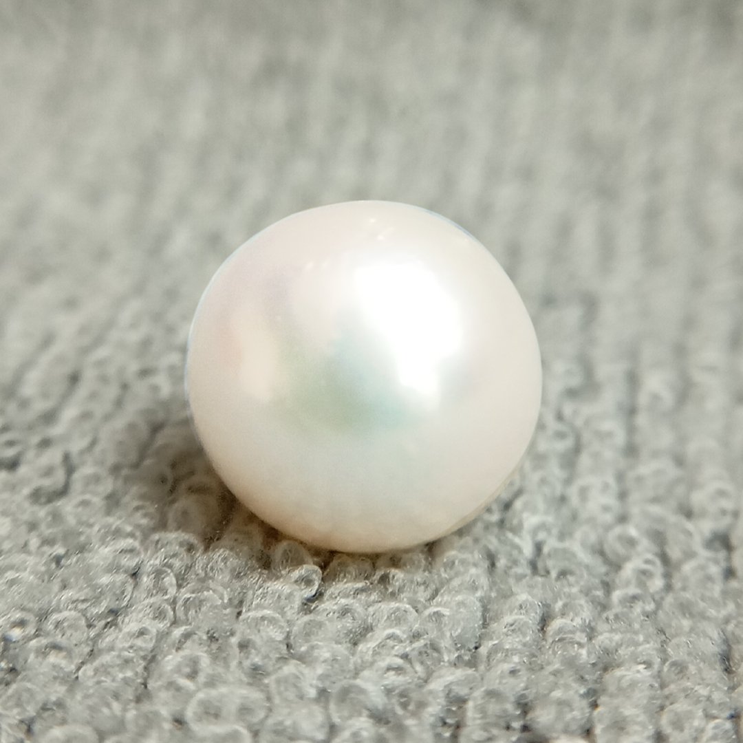 A genuine South Sea Pearl gemstone, revered for wisdom, emotional balance, and prosperity.