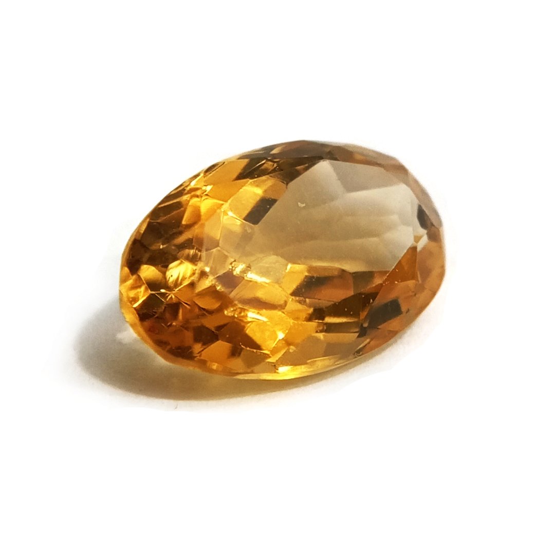 A close-up of a Natural Yellow Citrine gemstone with vibrant golden-yellow hues and sparkling clarity.