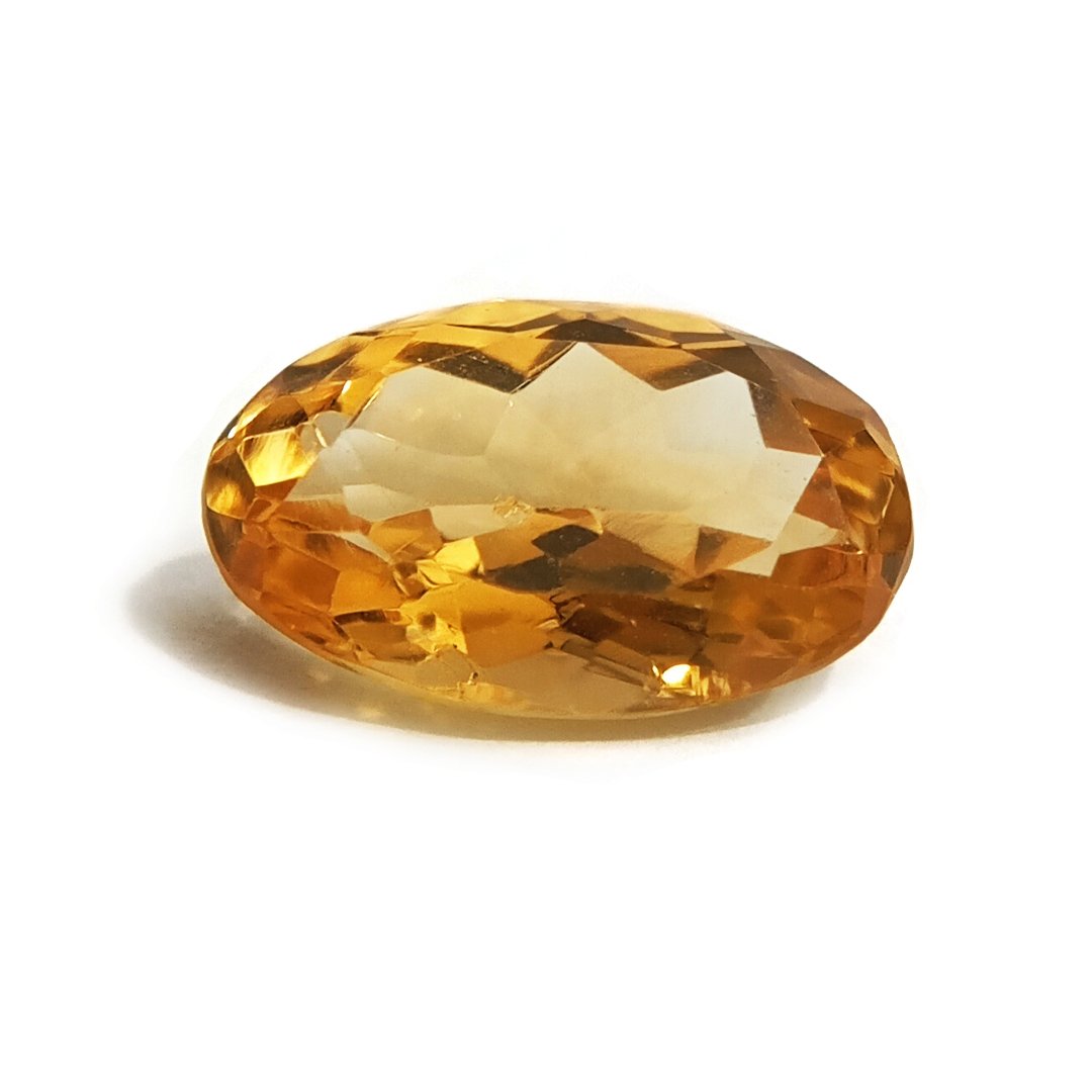 A close-up of a Natural Yellow Citrine gemstone with vibrant golden-yellow hues and sparkling clarity.