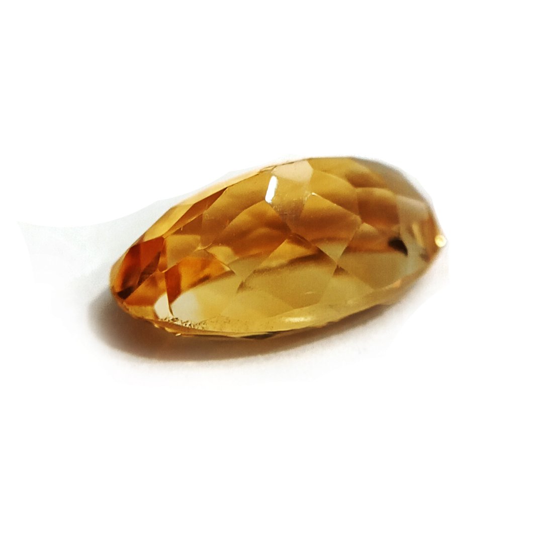 A close-up of a Natural Yellow Citrine gemstone with vibrant golden-yellow hues and sparkling clarity.