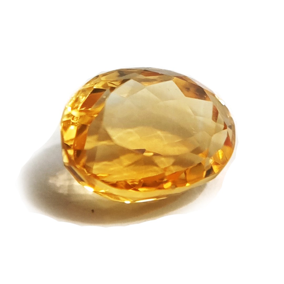 A close-up of a Natural Yellow Citrine gemstone with vibrant golden-yellow hues and sparkling clarity.