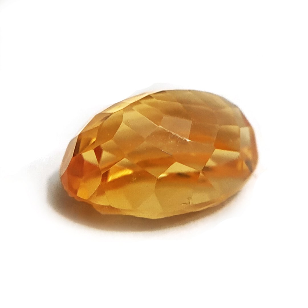 A close-up of a Natural Yellow Citrine gemstone with vibrant golden-yellow hues and sparkling clarity.