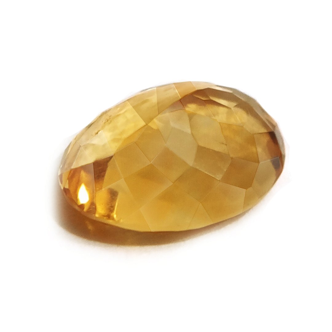 A close-up of a Natural Yellow Citrine gemstone with vibrant golden-yellow hues and sparkling clarity.
