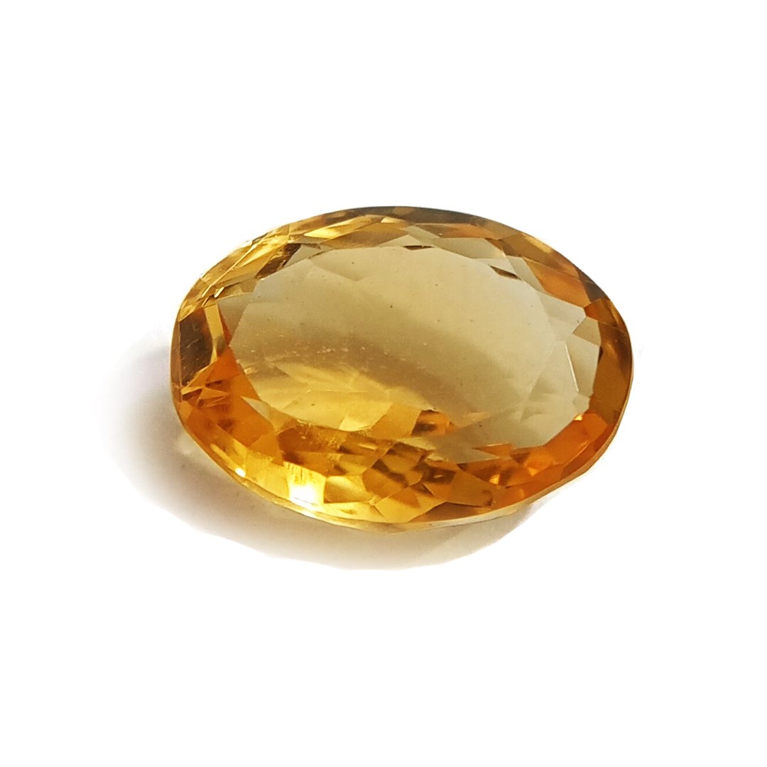 A close-up of a Natural Yellow Citrine gemstone with vibrant golden-yellow hues and sparkling clarity.