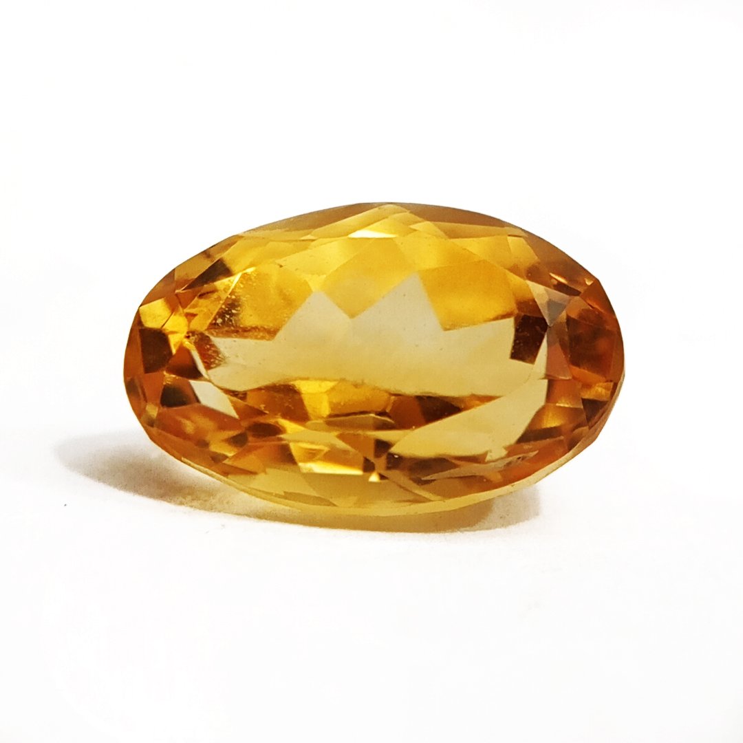 A close-up of a Natural Yellow Citrine gemstone with vibrant golden-yellow hues and sparkling clarity.