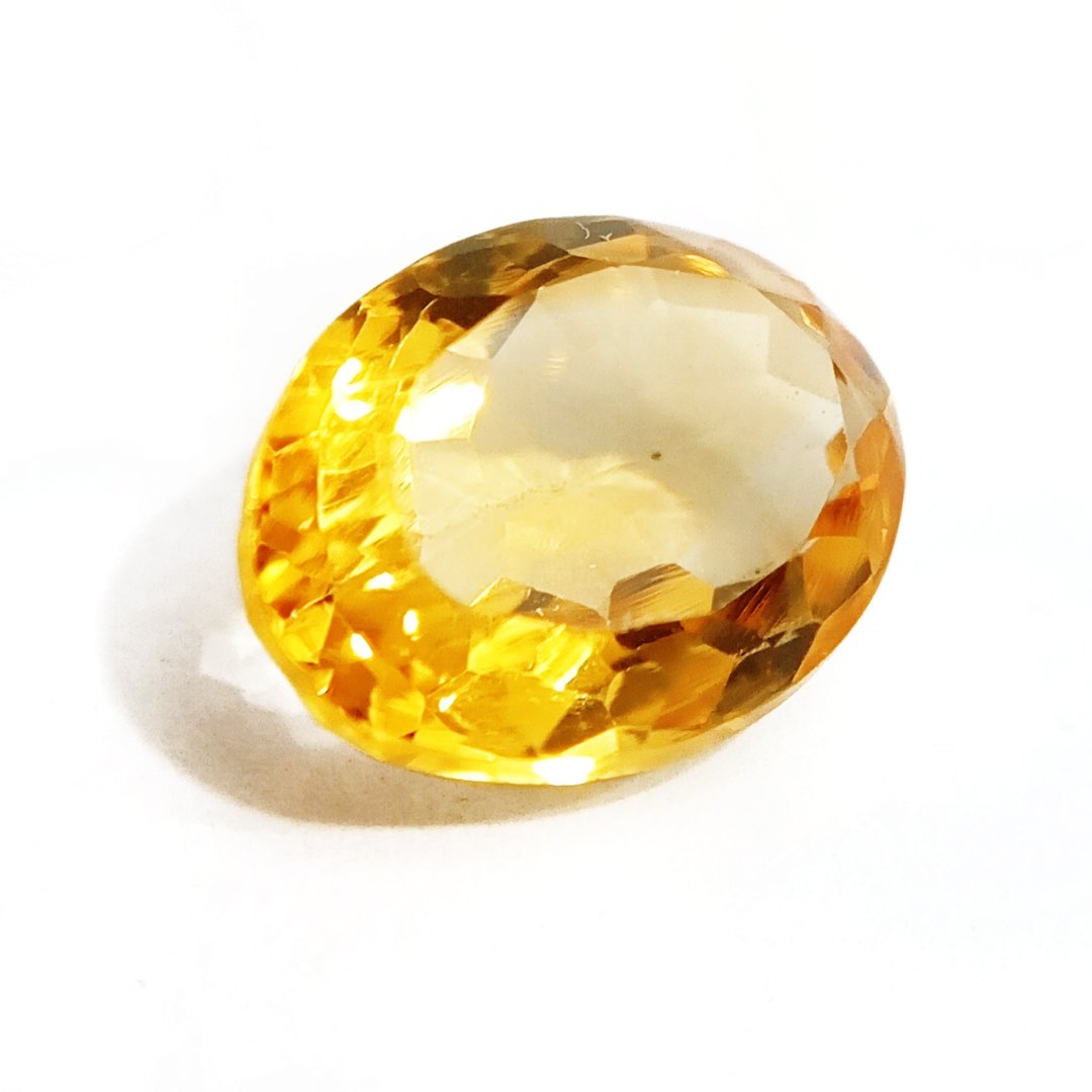A close-up of a Natural Yellow Citrine gemstone with vibrant golden-yellow hues and sparkling clarity.