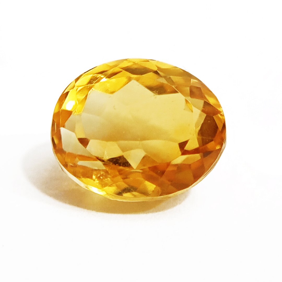 A close-up of a Natural Yellow Citrine gemstone with vibrant golden-yellow hues and sparkling clarity.