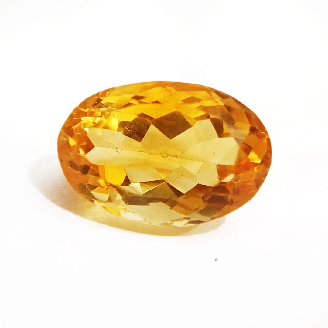 A close-up of a Natural Yellow Citrine gemstone with vibrant golden-yellow hues and sparkling clarity.
