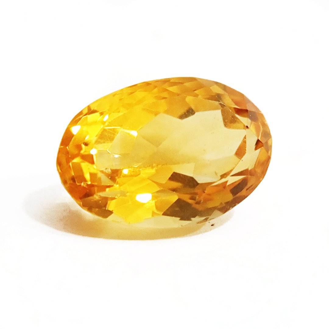 A close-up of a Natural Yellow Citrine gemstone with vibrant golden-yellow hues and sparkling clarity.