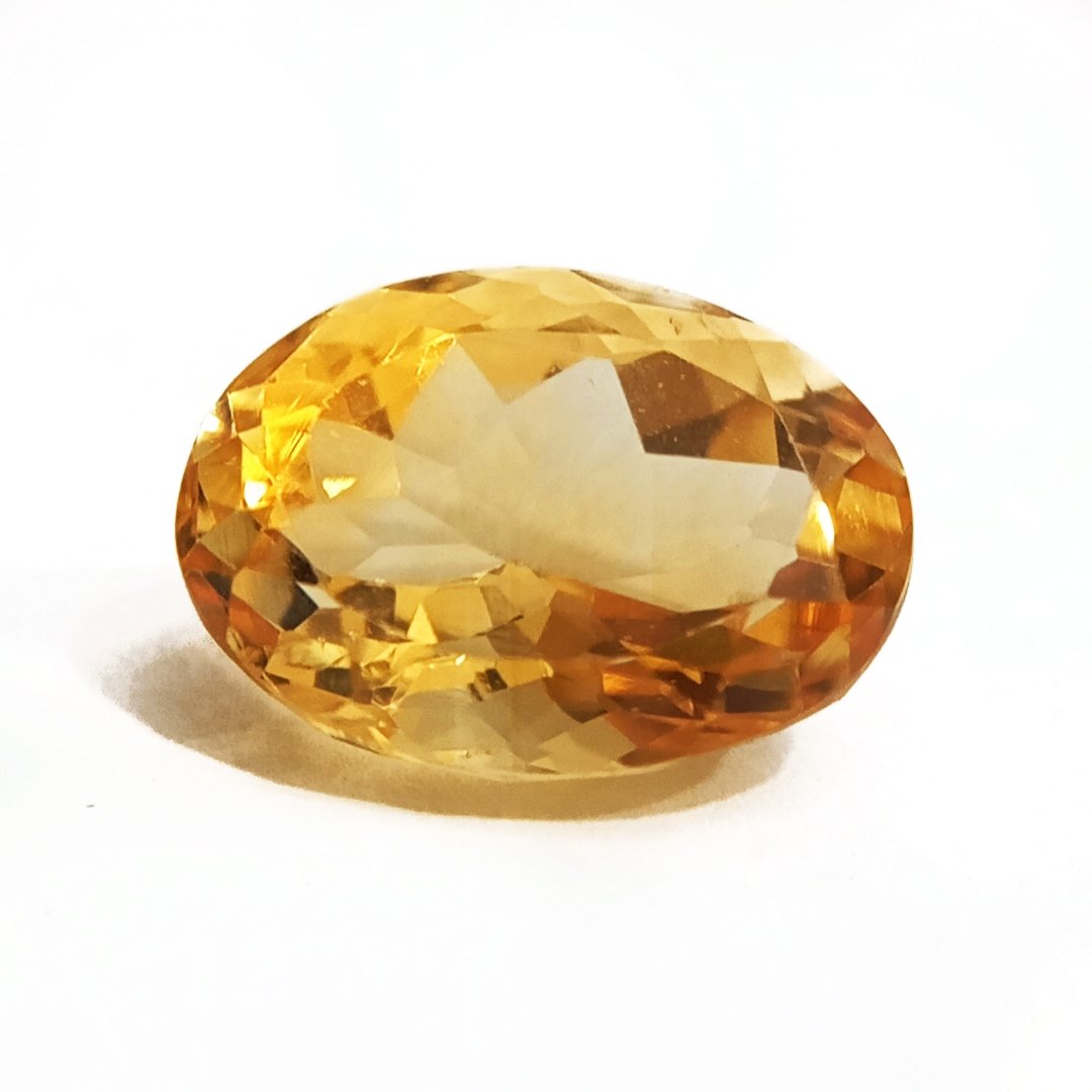 A close-up of a Natural Yellow Citrine gemstone with vibrant golden-yellow hues and sparkling clarity.