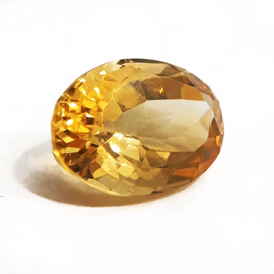 A close-up of a Natural Yellow Citrine gemstone with vibrant golden-yellow hues and sparkling clarity.