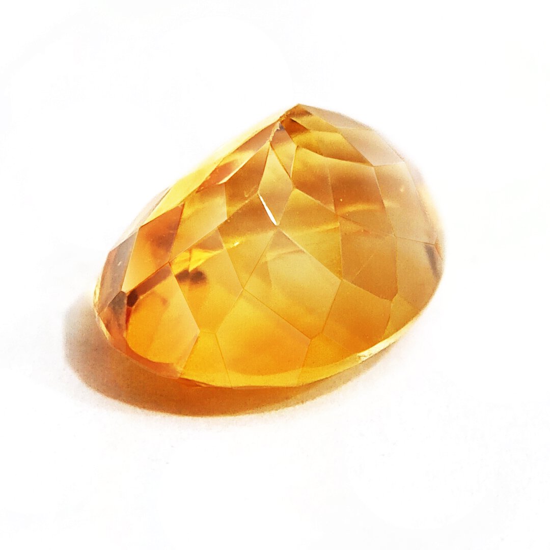 A close-up of a Natural Yellow Citrine gemstone with vibrant golden-yellow hues and sparkling clarity.