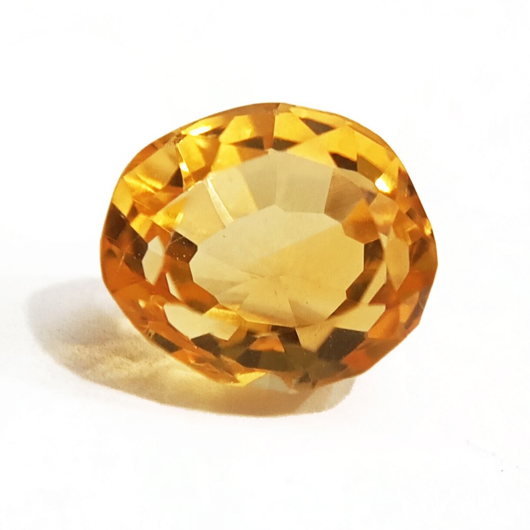 A close-up of a Natural Yellow Citrine gemstone with vibrant golden-yellow hues and sparkling clarity.