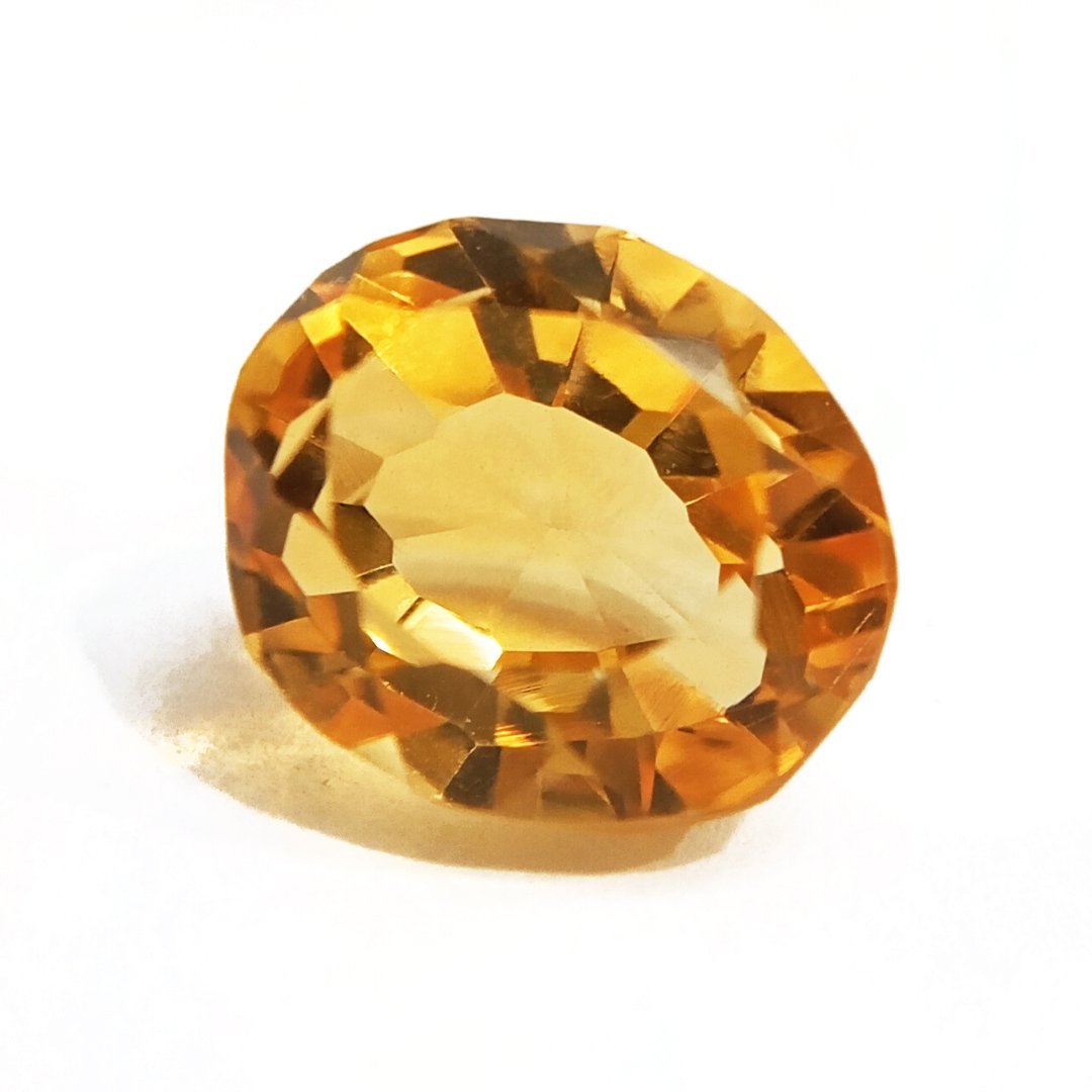 A close-up of a Natural Yellow Citrine gemstone with vibrant golden-yellow hues and sparkling clarity.