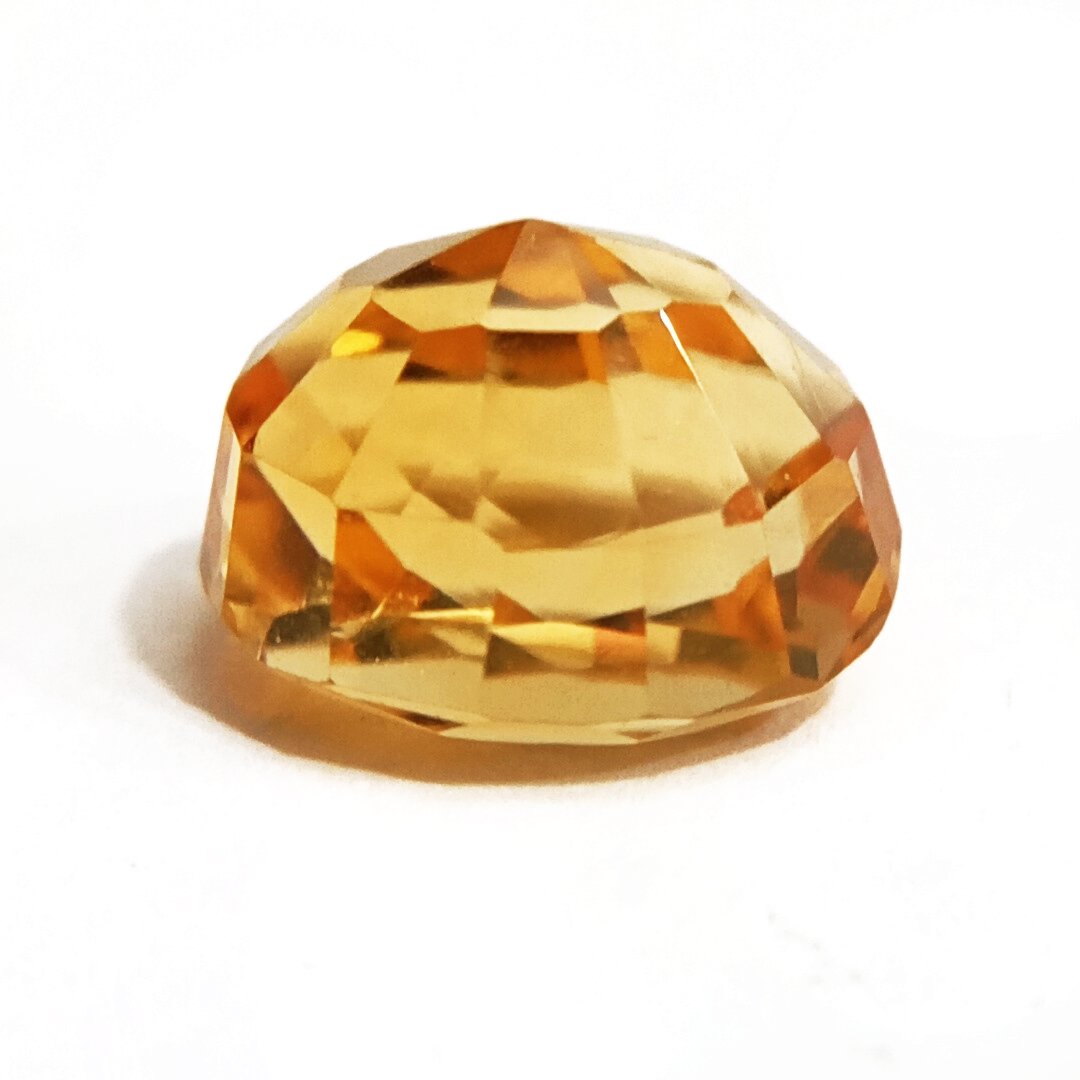 A close-up of a Natural Yellow Citrine gemstone with vibrant golden-yellow hues and sparkling clarity.