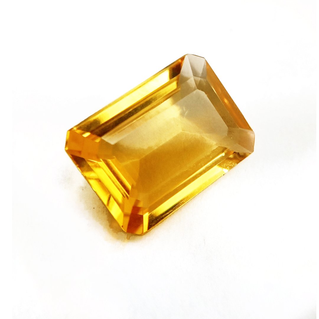 A close-up of a Natural Yellow Citrine gemstone with vibrant golden-yellow hues and sparkling clarity.
