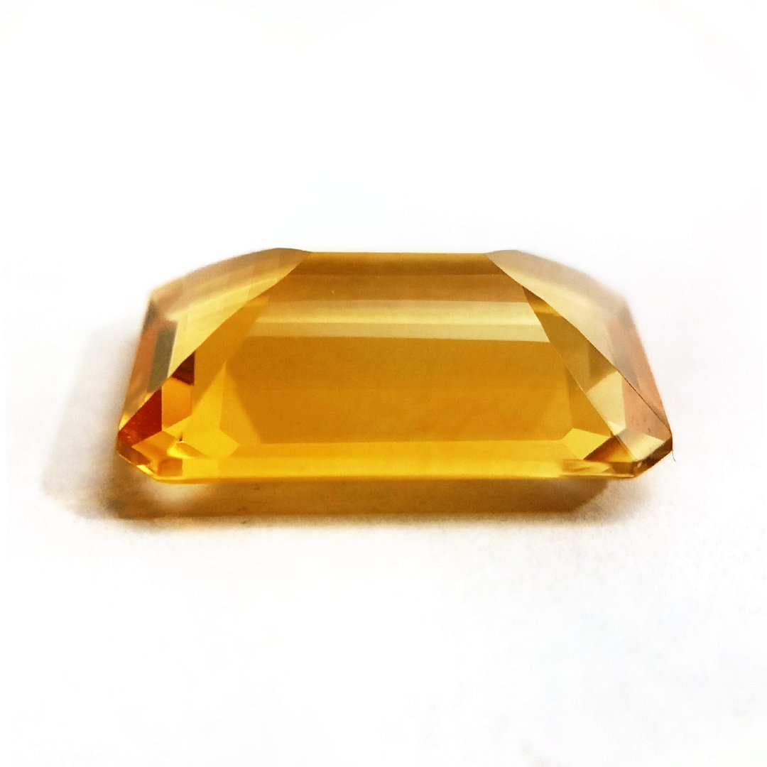 A close-up of a Natural Yellow Citrine gemstone with vibrant golden-yellow hues and sparkling clarity.