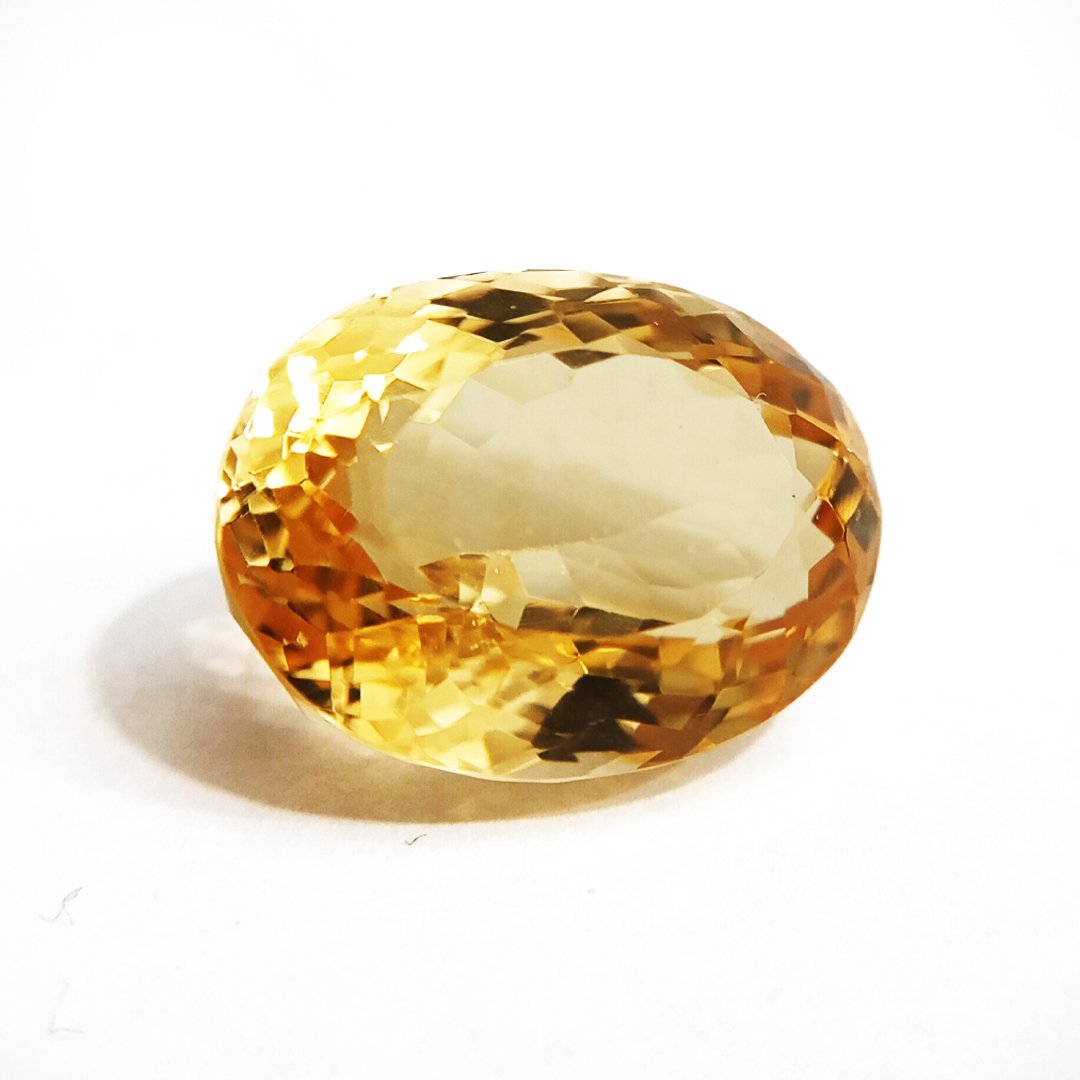 A close-up of a Natural Yellow Citrine gemstone with vibrant golden-yellow hues and sparkling clarity.