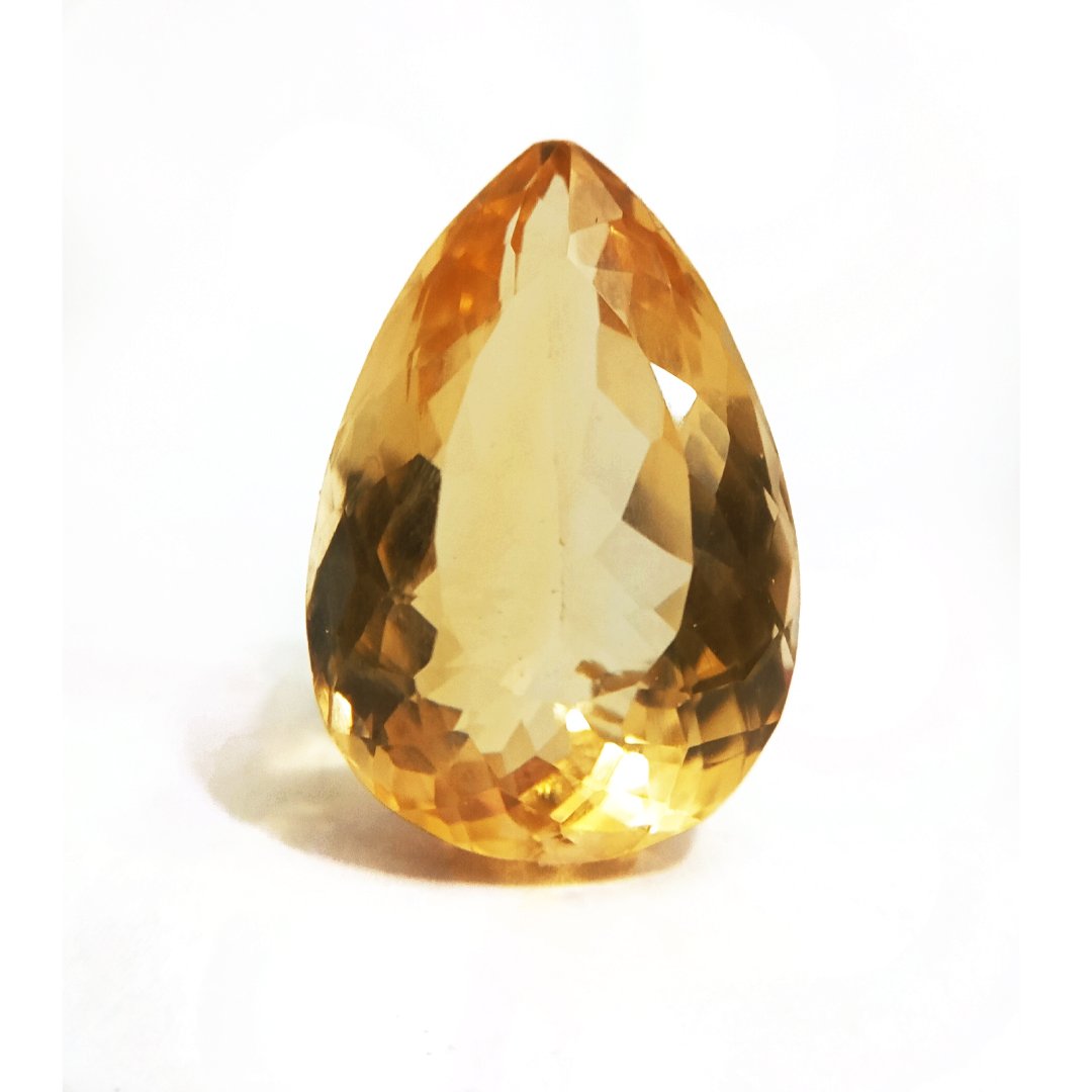 A close-up of a Natural Yellow Citrine gemstone with vibrant golden-yellow hues and sparkling clarity.