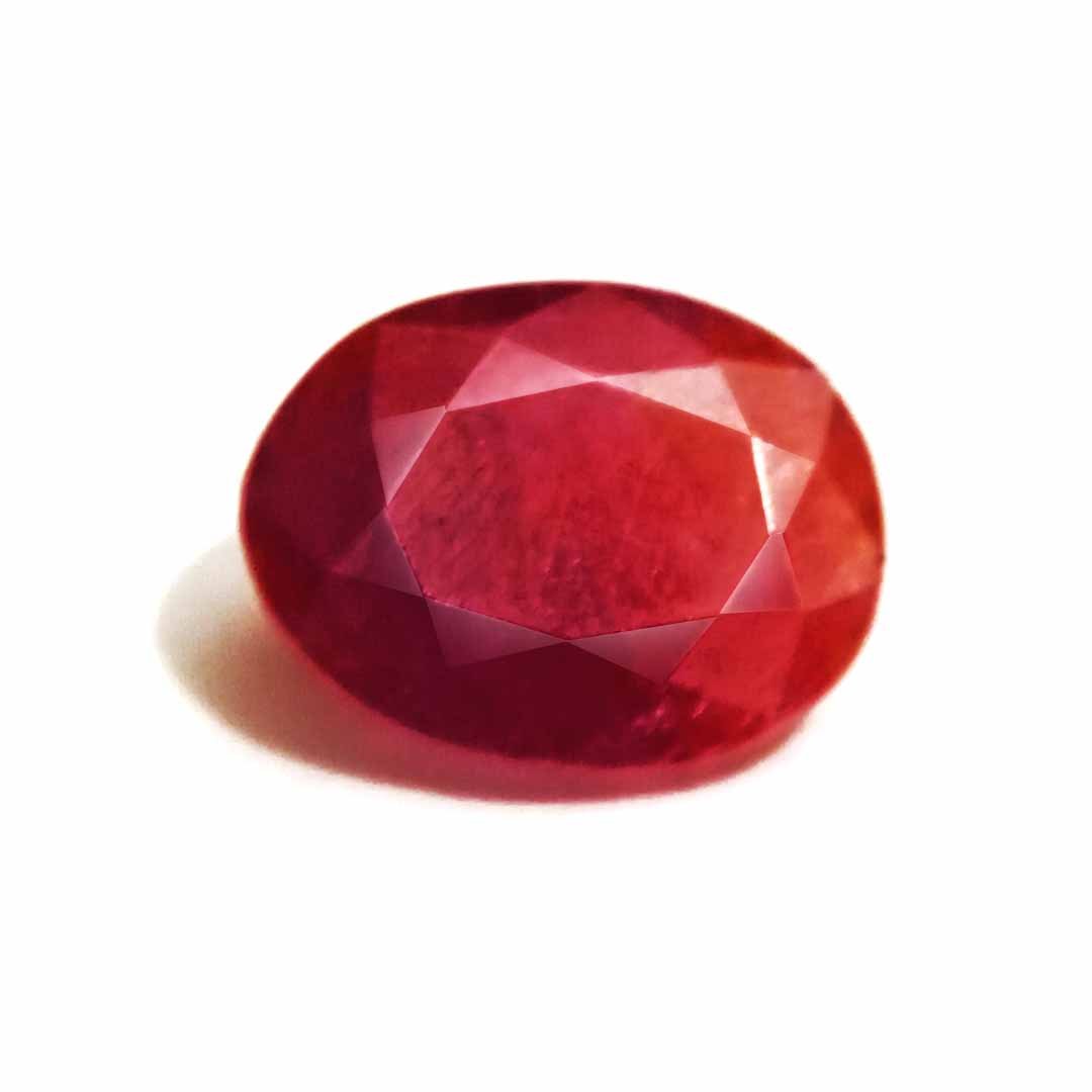 A close-up of a Natural African Ruby gemstone showcasing its rich red hue and brilliant clarity.