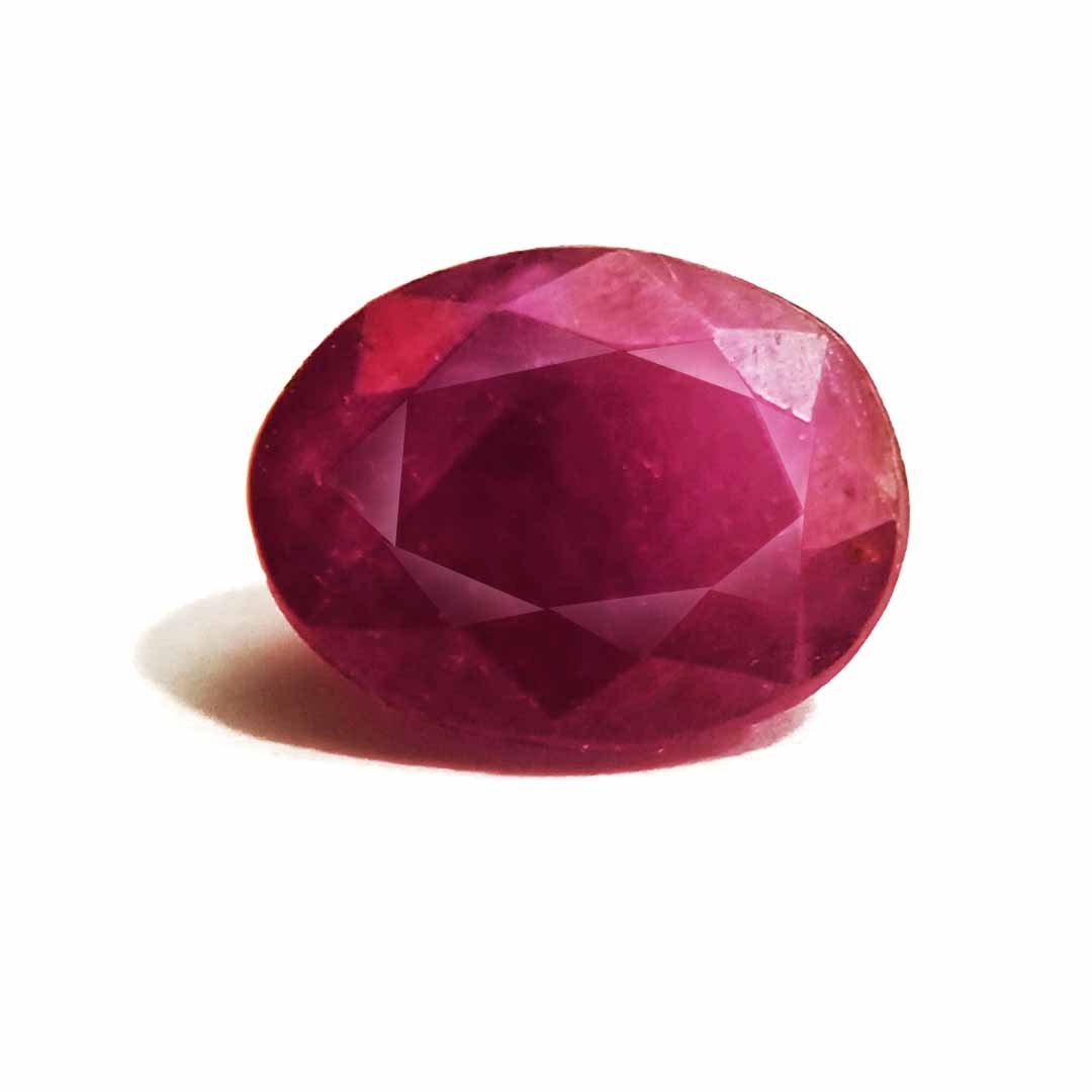 A close-up of a Natural African Ruby gemstone showcasing its rich red hue and brilliant clarity.