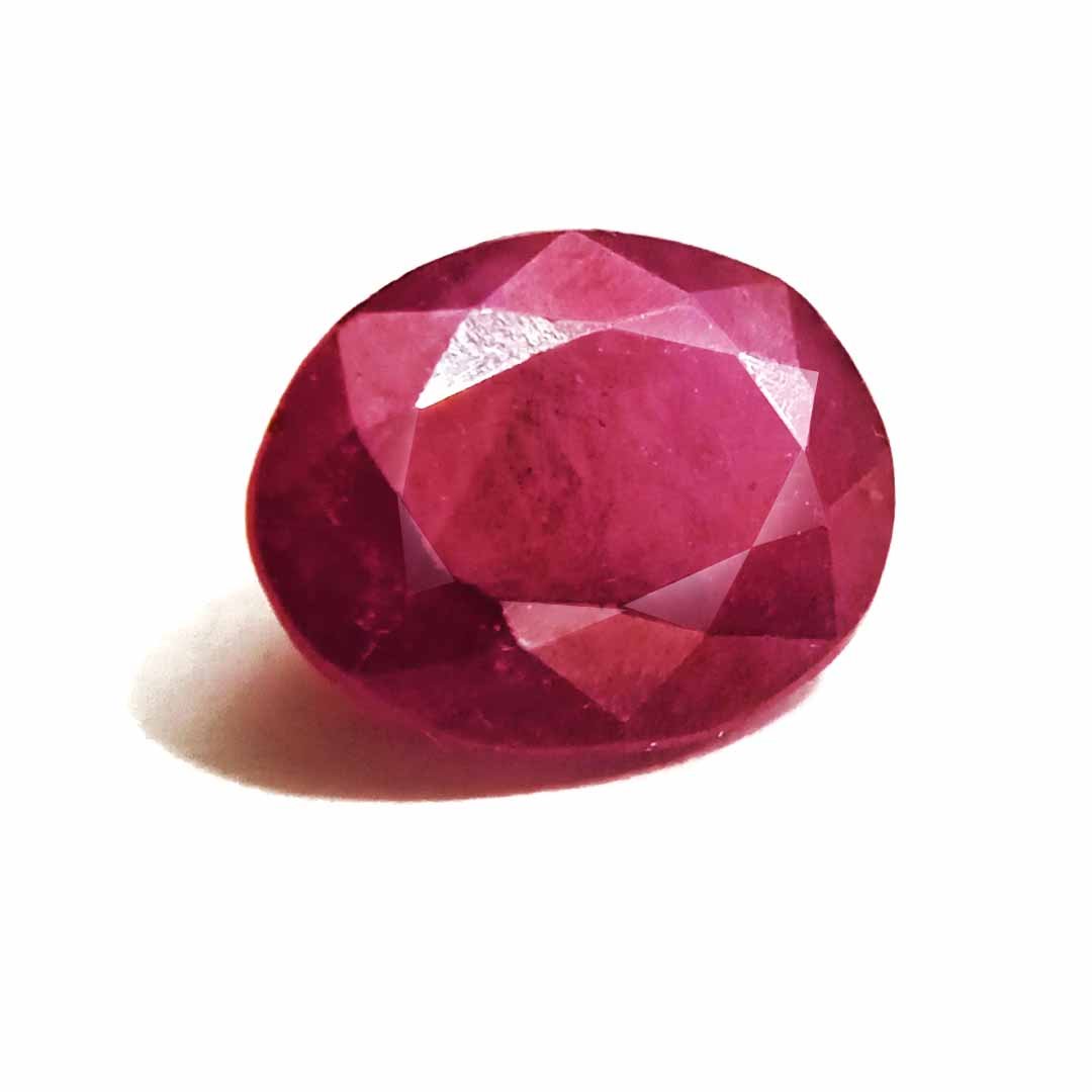 A close-up of a Natural African Ruby gemstone showcasing its rich red hue and brilliant clarity.