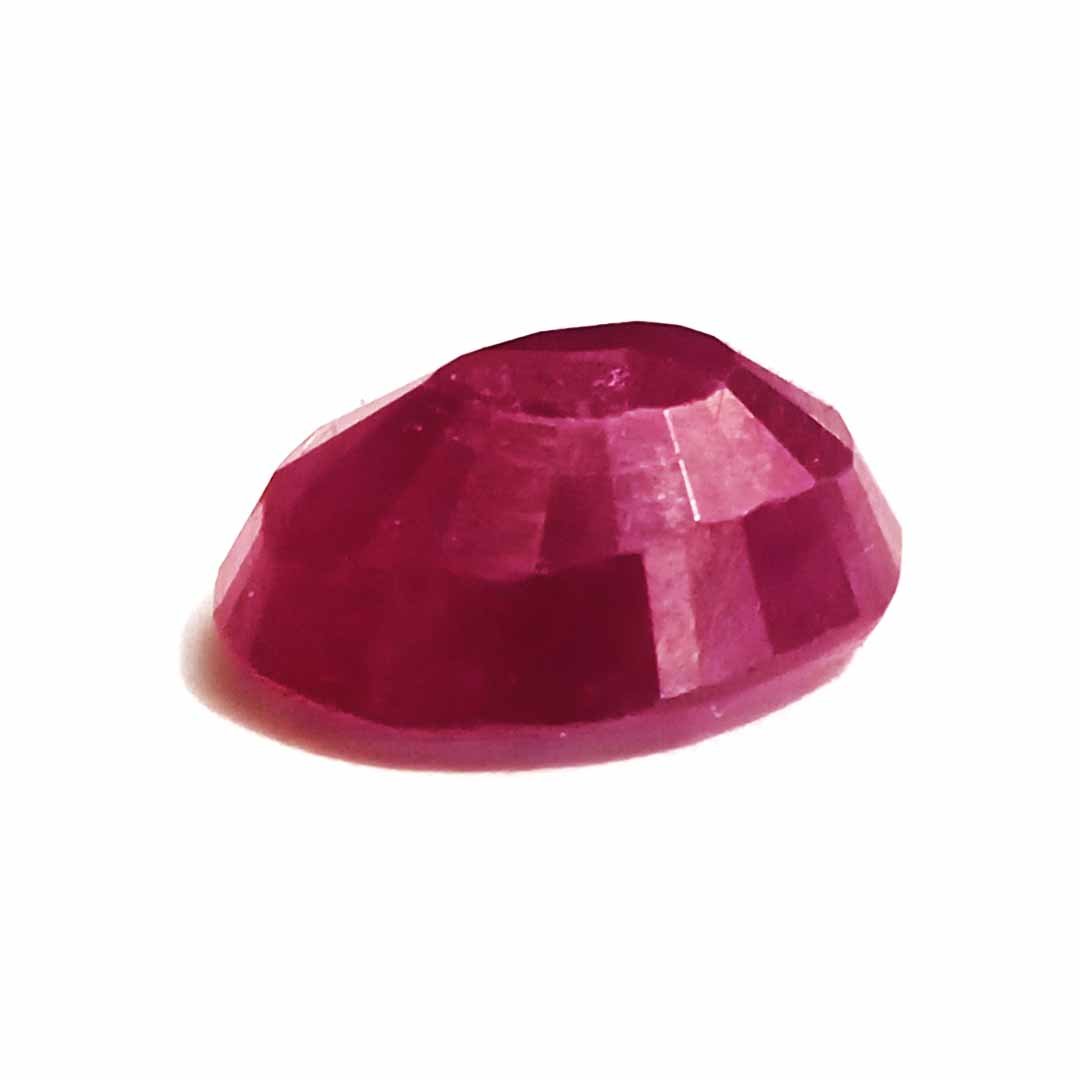 A close-up of a Natural African Ruby gemstone showcasing its rich red hue and brilliant clarity.