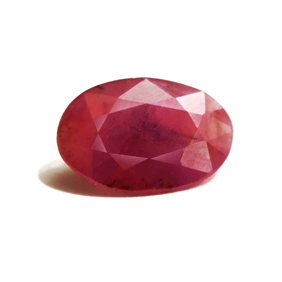 A close-up of a Natural African Ruby gemstone showcasing its rich red hue and brilliant clarity.