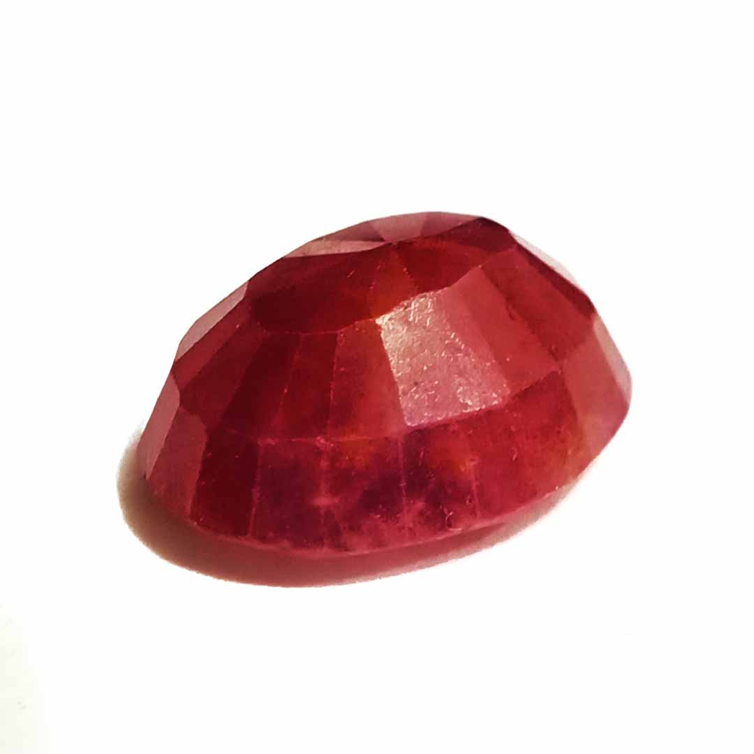 A close-up of a Natural African Ruby gemstone showcasing its rich red hue and brilliant clarity.