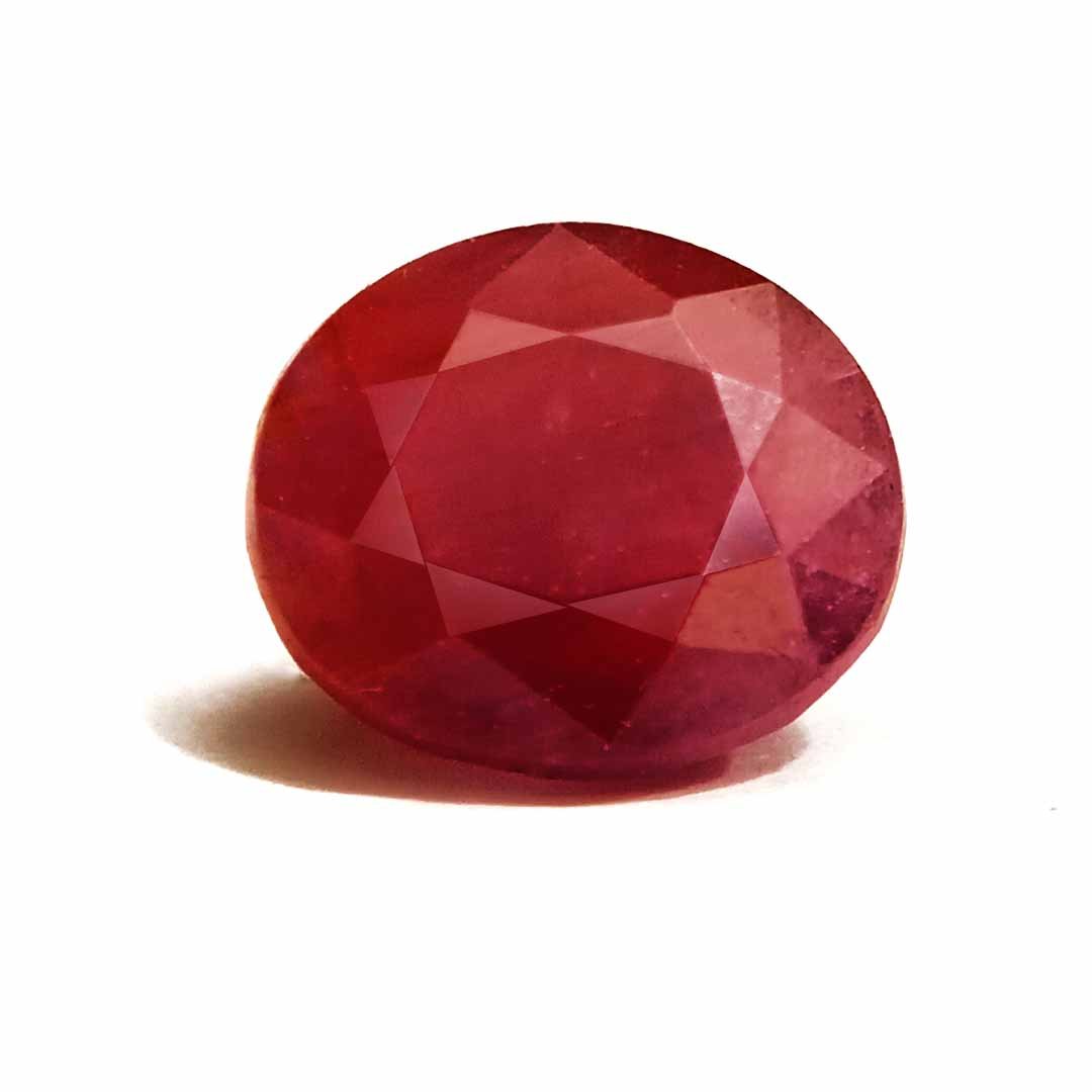A close-up of a Natural African Ruby gemstone showcasing its rich red hue and brilliant clarity.