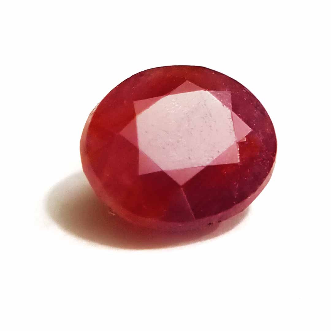 A close-up of a Natural African Ruby gemstone showcasing its rich red hue and brilliant clarity.