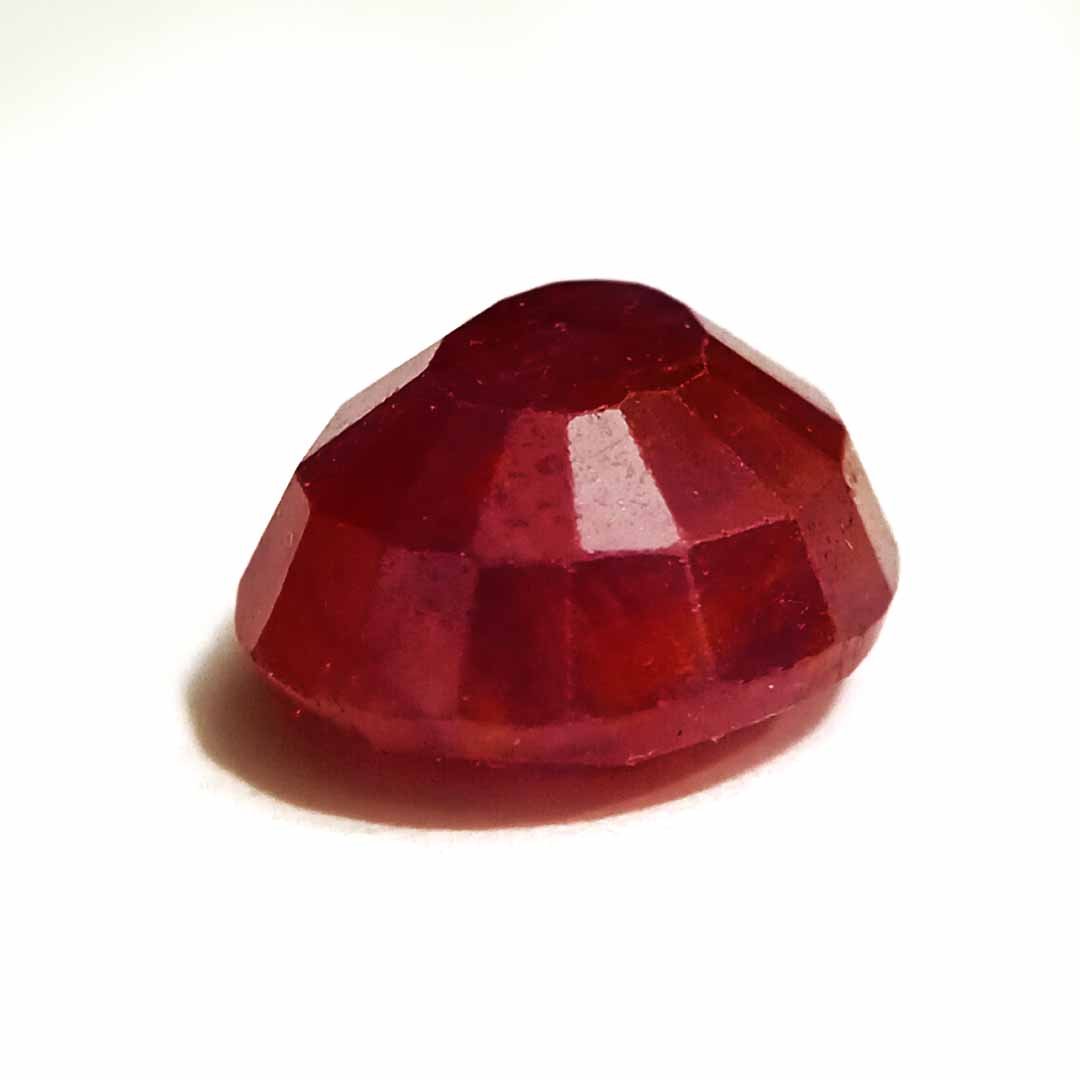 A close-up of a Natural African Ruby gemstone showcasing its rich red hue and brilliant clarity.