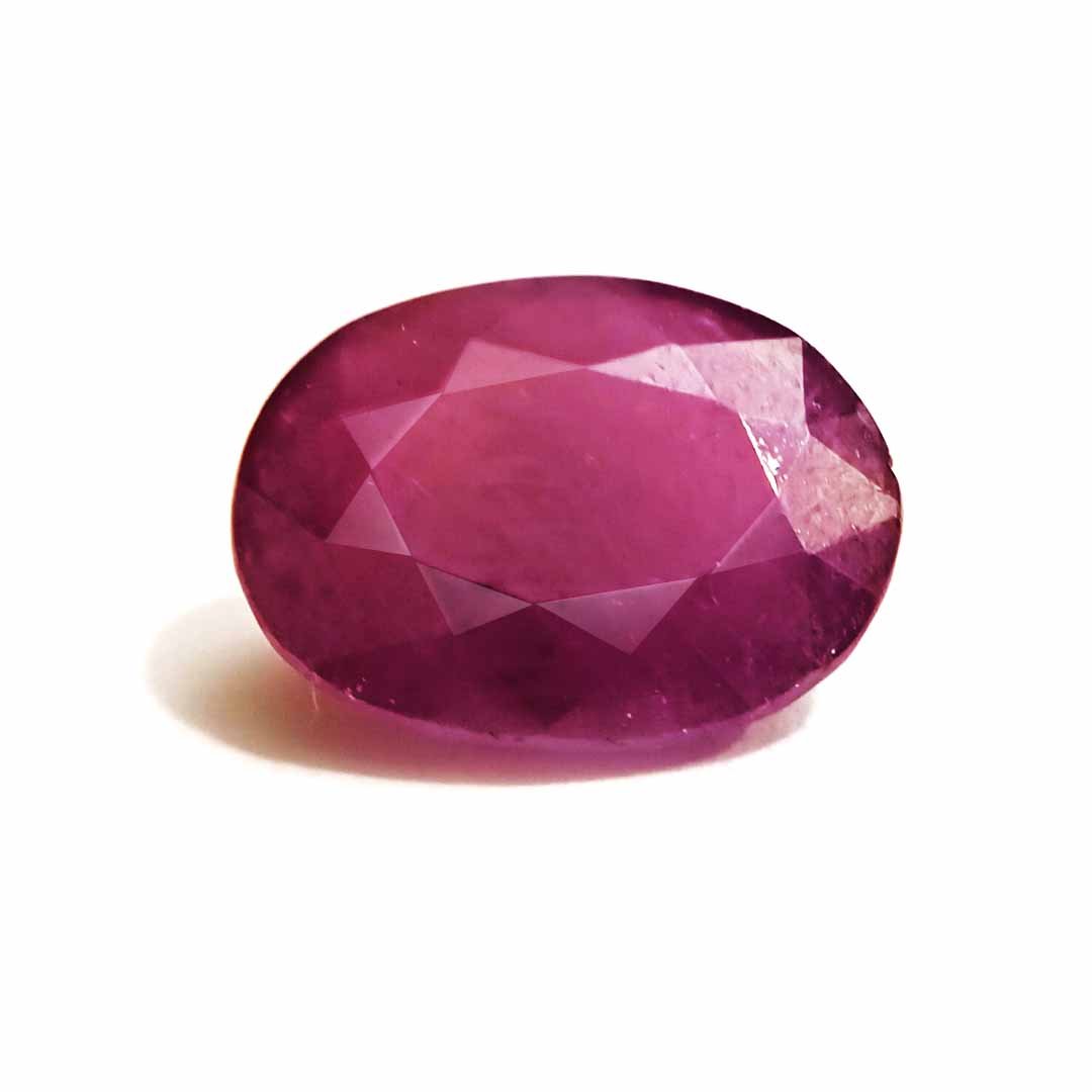A close-up of a Natural African Ruby gemstone showcasing its rich red hue and brilliant clarity.