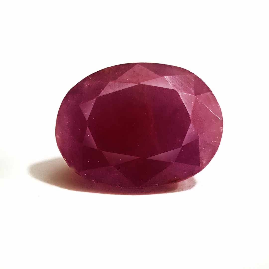 A close-up of a Natural African Ruby gemstone showcasing its rich red hue and brilliant clarity.