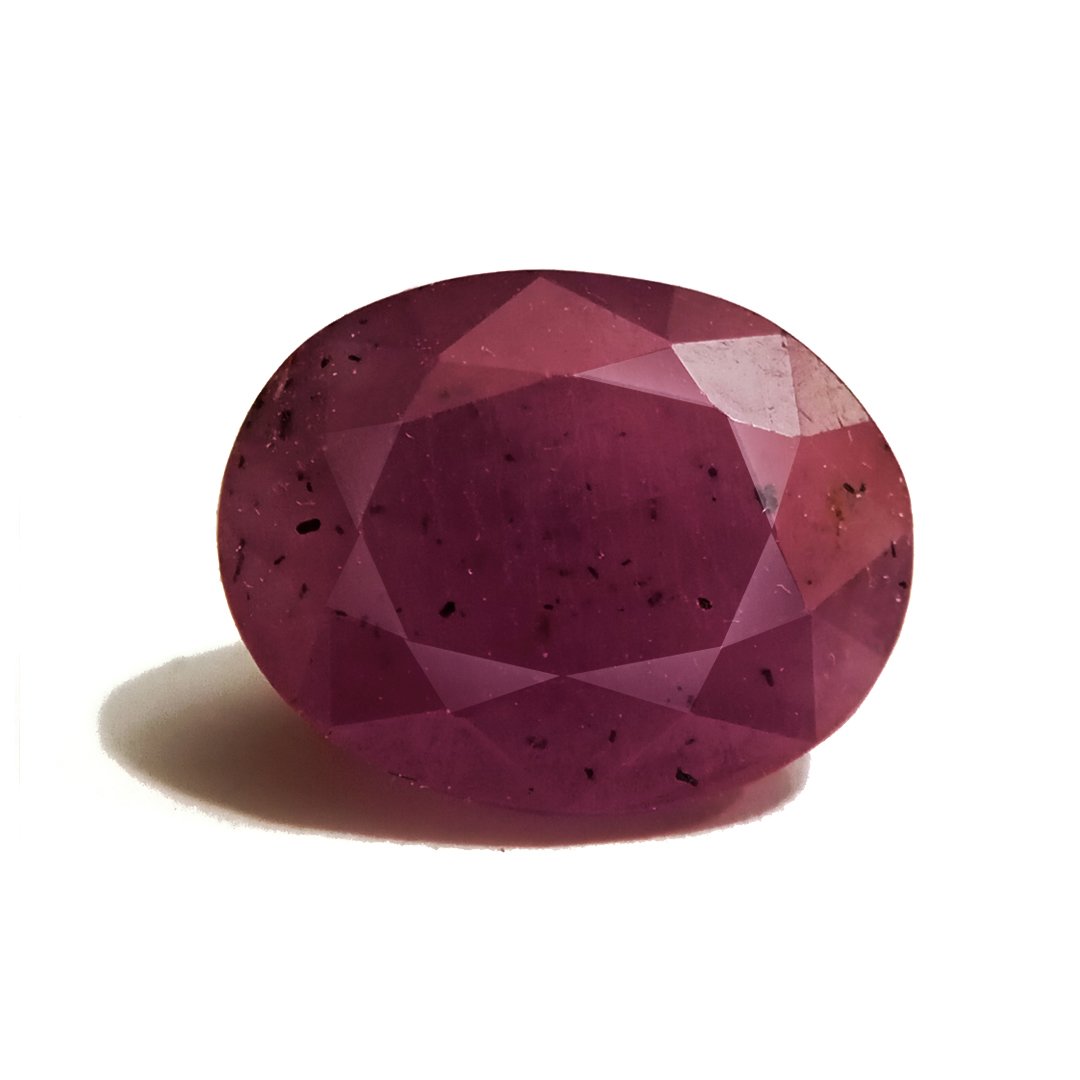 A close-up of a Natural African Ruby gemstone showcasing its rich red hue and brilliant clarity.